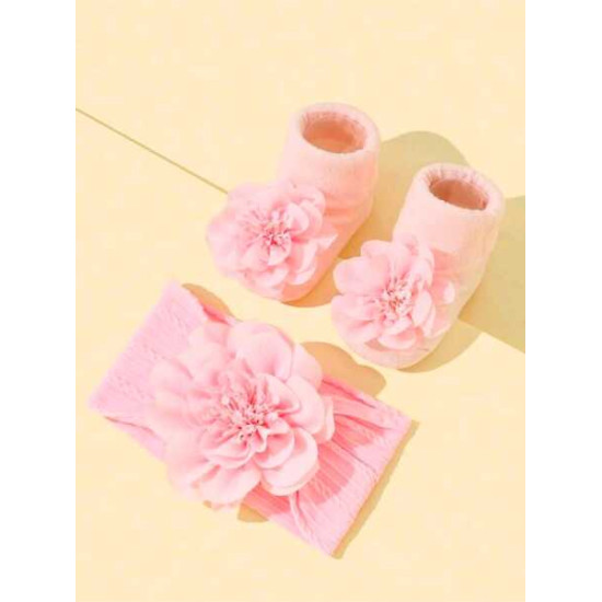 جوارب مانعة للانزلاق وربطة رأس بلون وردي الى 6 شهر