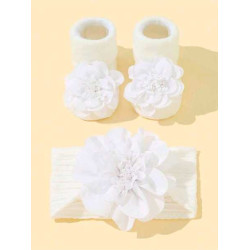 جوارب مانعة للانزلاق وربطة رأس بلون ابيض الى 6 شهر