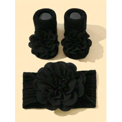 جوارب مانعة للانزلاق وربطة رأس بلون اسود الى 6 شهر