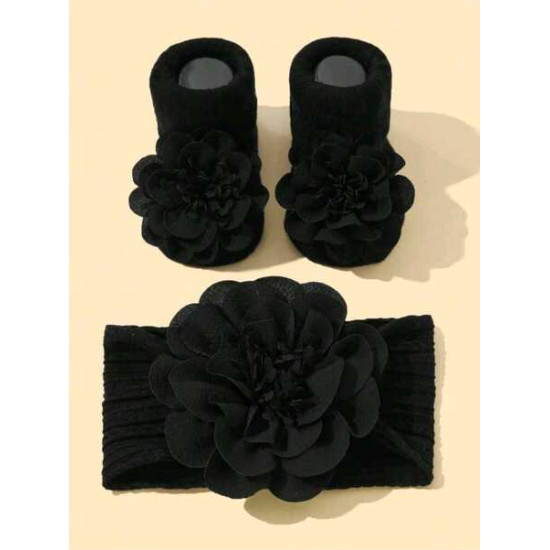 جوارب مانعة للانزلاق وربطة رأس بلون اسود الى 6 شهر