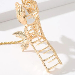 قباضة شعر بتصميم زهرة بلون ذهبي